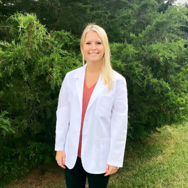 Madison Gates wearing her white coat outside