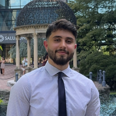 Mohammad wearing a dress shirt and tie