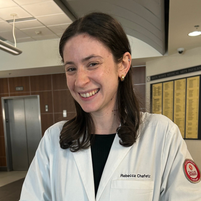 Becca in her white coat