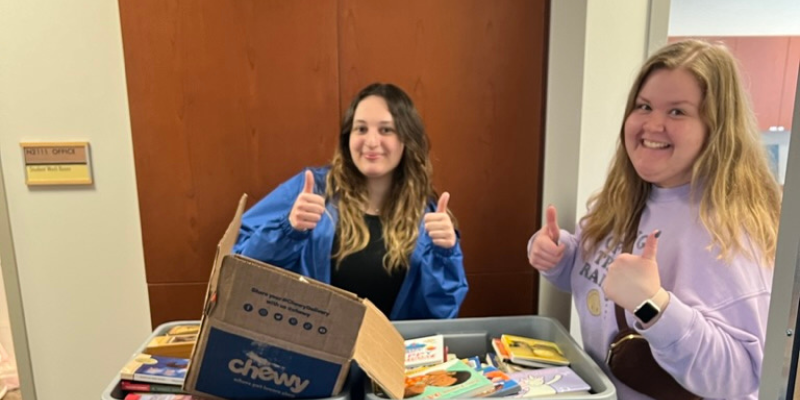 Sarah and SLP student organizing food drive