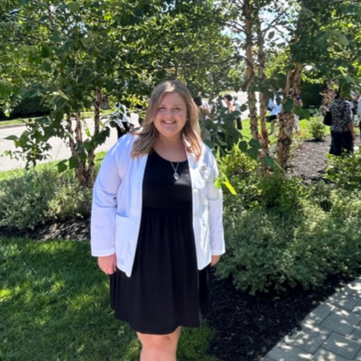 Sarah in her white coat