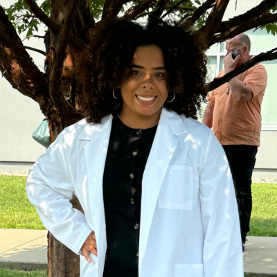 Anisa in her white coat