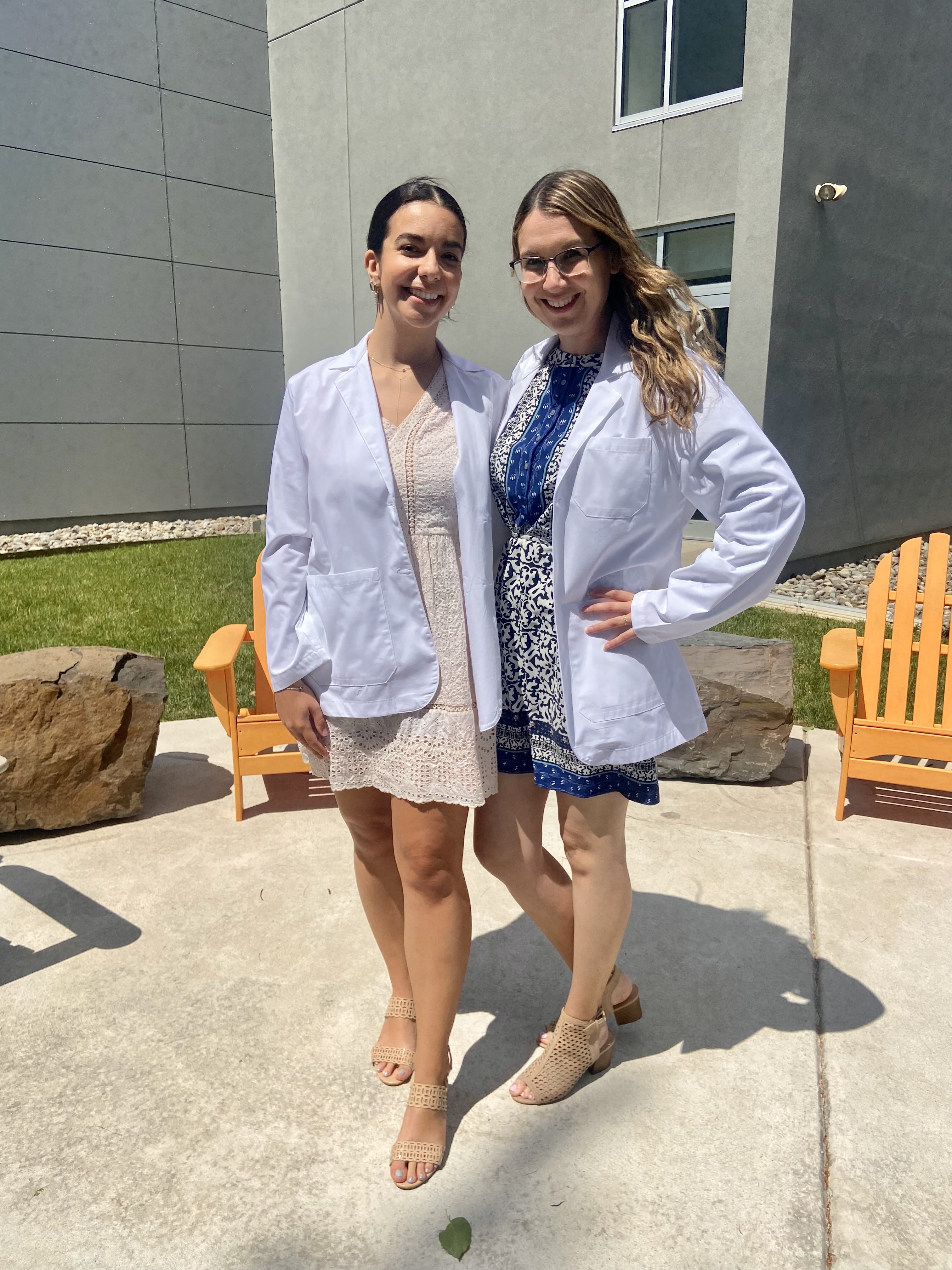 Clarissa and classmate wearing white coats