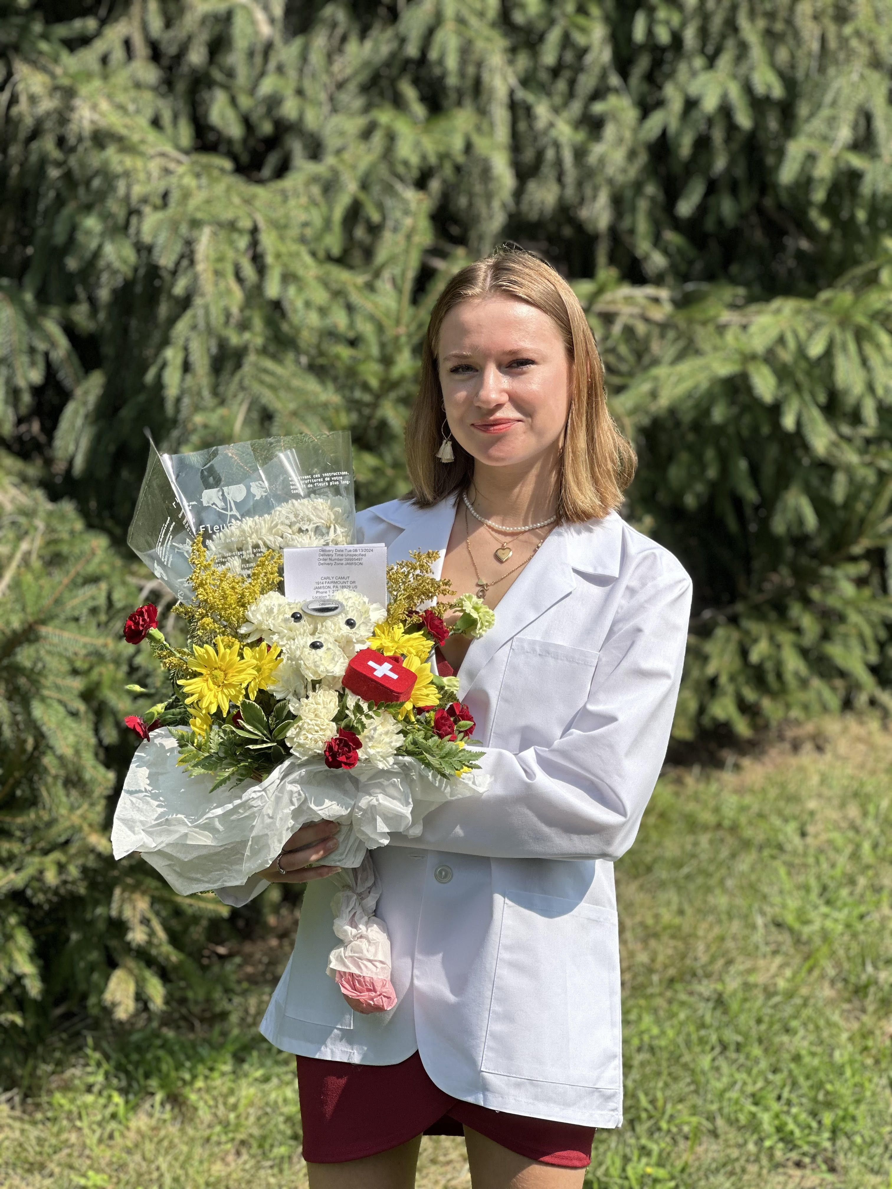 Carly in her white coat